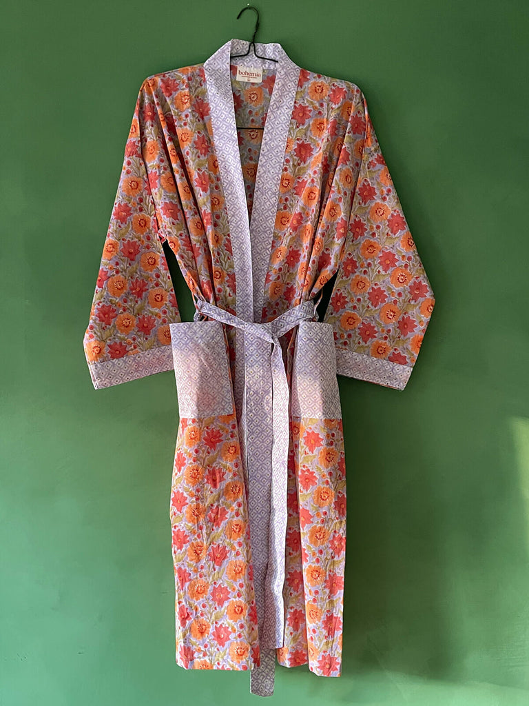 Beautiful cotton robe in lilac with vibrant marigold flowers, pockets and a matching belt by Bohemia Design.