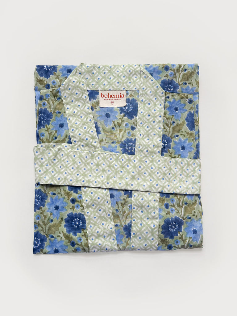 Flat-folded cotton robe in sage green with complementary block print floral patterns on a white background | Bohemia