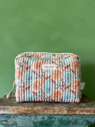 Large Floribunda Washbag in Duck Egg with a blue and terracotta floral print, front view | Bohemia