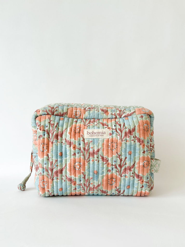 Large Floribunda cotton quilted wash bag with hand block printed floral design in soft duck egg by Bohemia Design