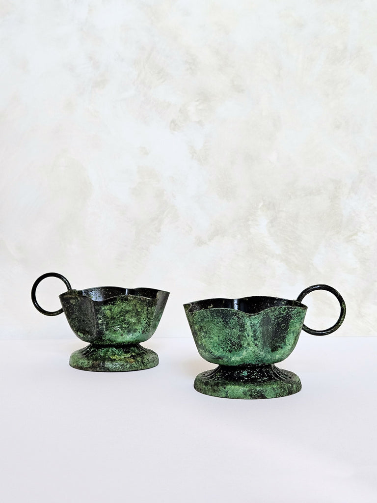 A couple of Frill candle holders with distinct rustic green moss textures, showcasing their unique differences | Bohemia Bohemia