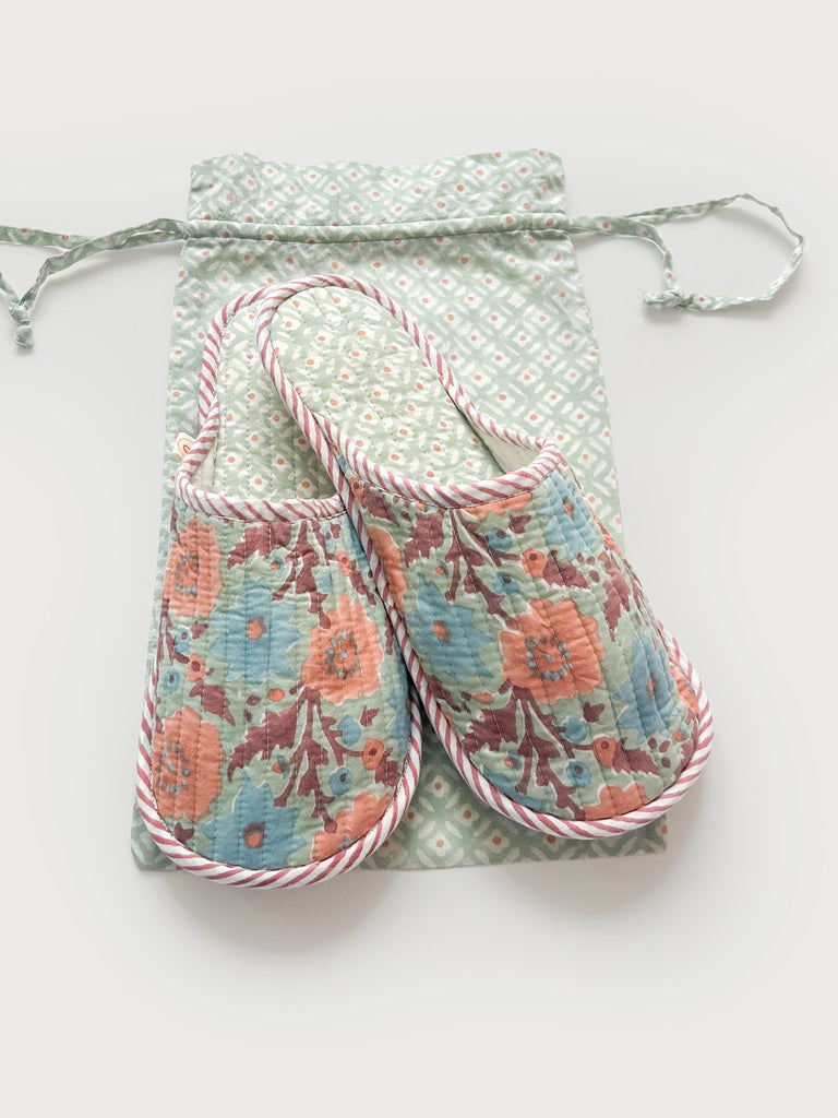 A pair of floral house slippers with a lining in a contrasting Ditsy print and a matching cotton voile drawstring bag - ideal for travel | Bohemia Design