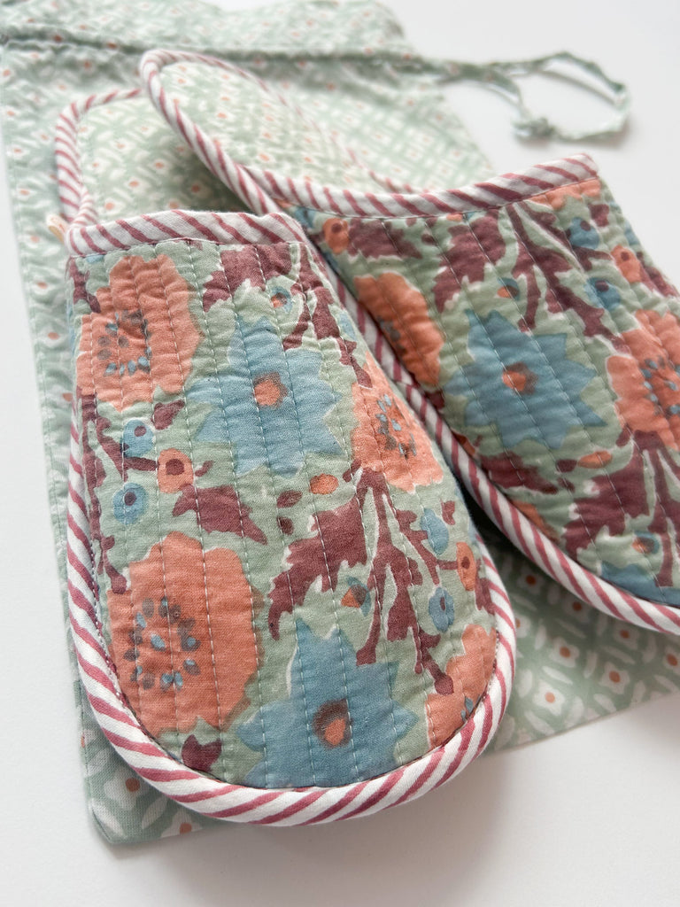 A closeup of soft cotton floral house slippers in duck egg with muted terracotta, pink and dusty blue accents | Bohemia