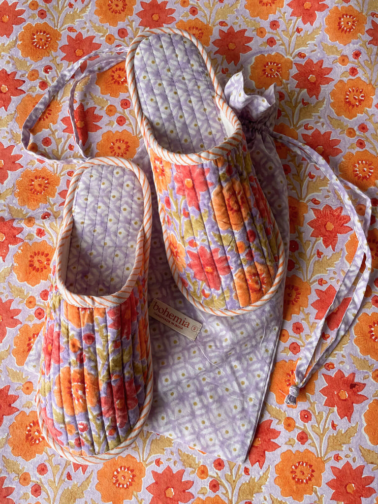 Soft, lightweight Floribunda-patterned house slippers with a ditsy print drawstring bag on a matching floral background, Lilac | Bohemia.