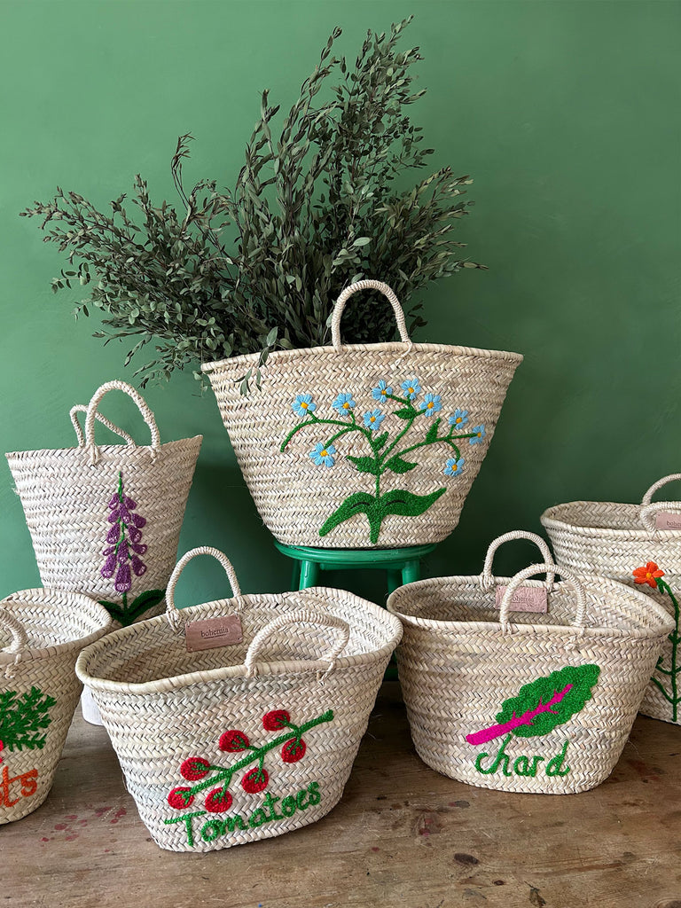 Collection of hand embroidered basket bags in various shapes, sizes and designs by Bohemia Design