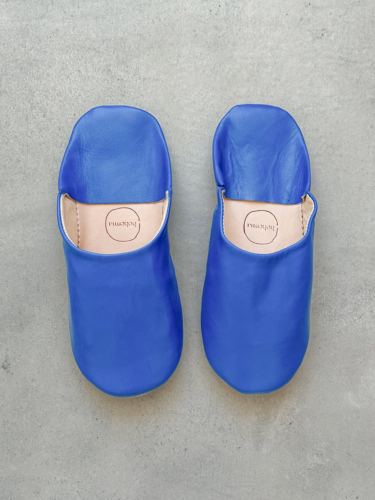 Woman's leather slippers in Majorelle blue on a grey background | Bohemia