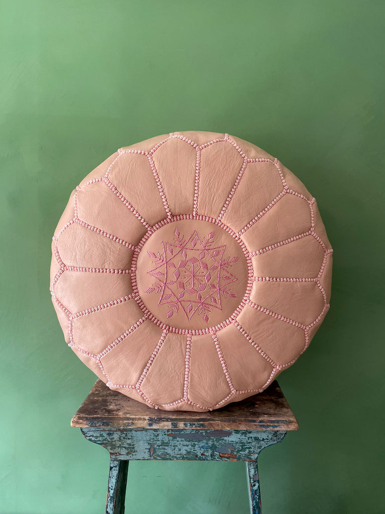 Handmade Moroccan leather pouffe in ballet pink showing an embroidered top section | Bohemia