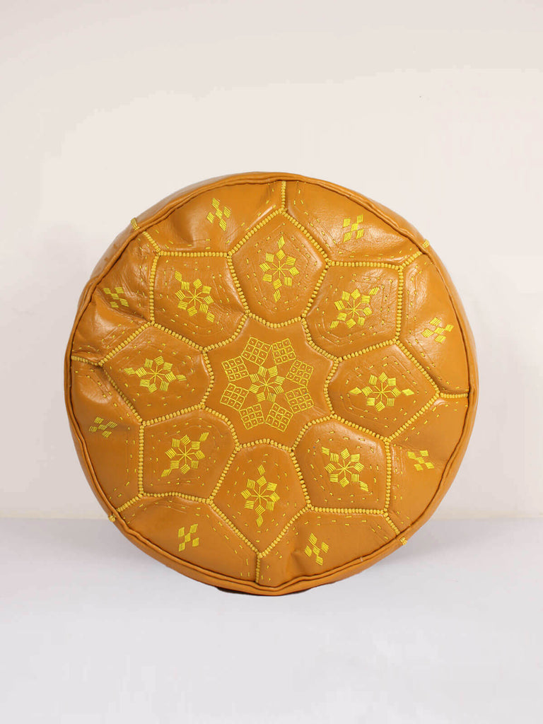 Moroccan leather tile pouffe in mustard with intricate hand embroidered patterns