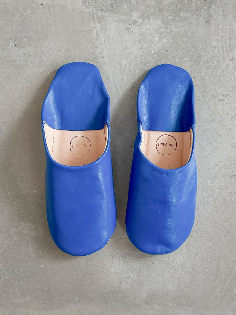 Men's Moroccan leather slippers in deep Majorelle blue on a grey background | Bohemia