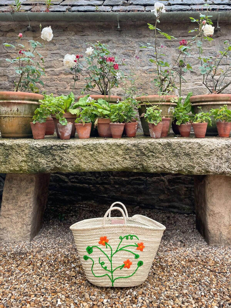 Hand-embroidered market basket bag with a vibrant Nasturtium floral motif, perfect for a garden centre setting | BohemiaDesign