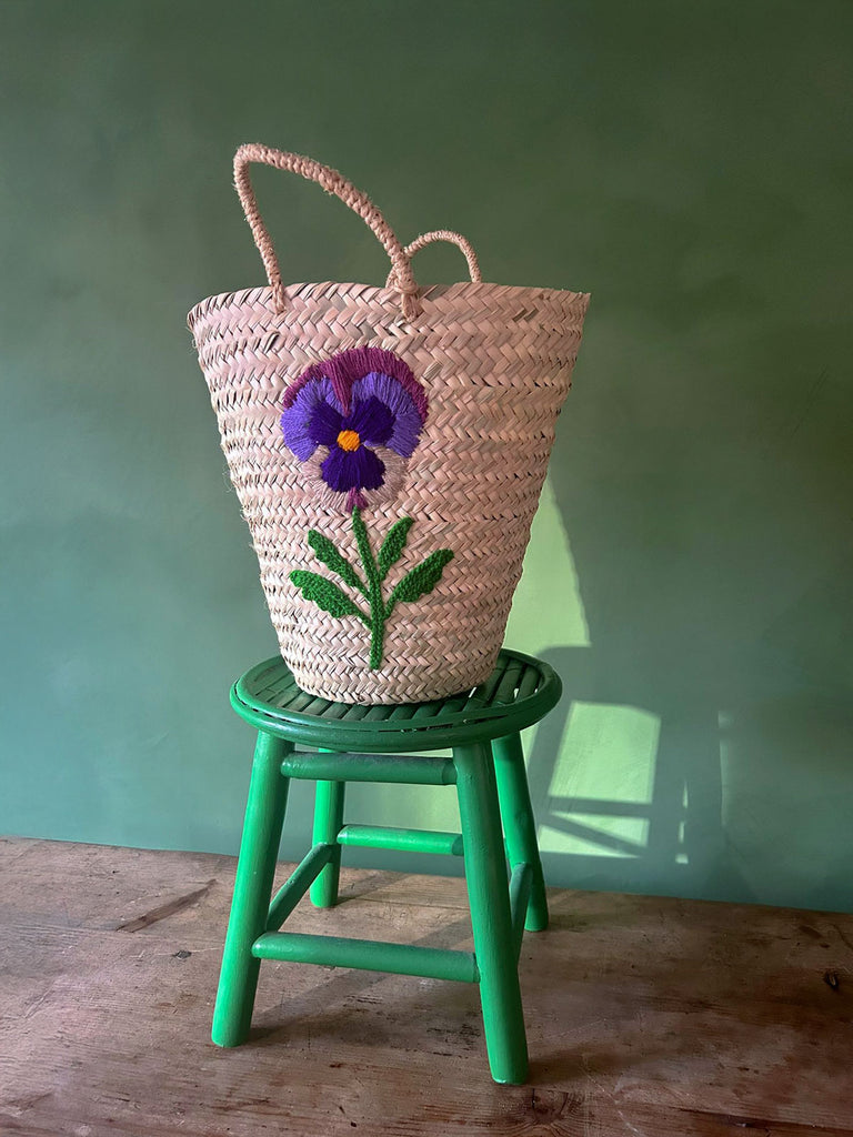 Handcrafted sustainable palm leaf basket bag with elegant hand-embroidered pansy flower | BohemiaDesign