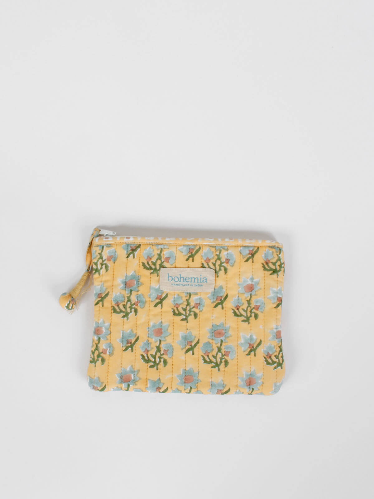 Medium quilted cotton zip pouch hand block printed in Jaipur, fully lined with a buttermilk yellow ditsy print