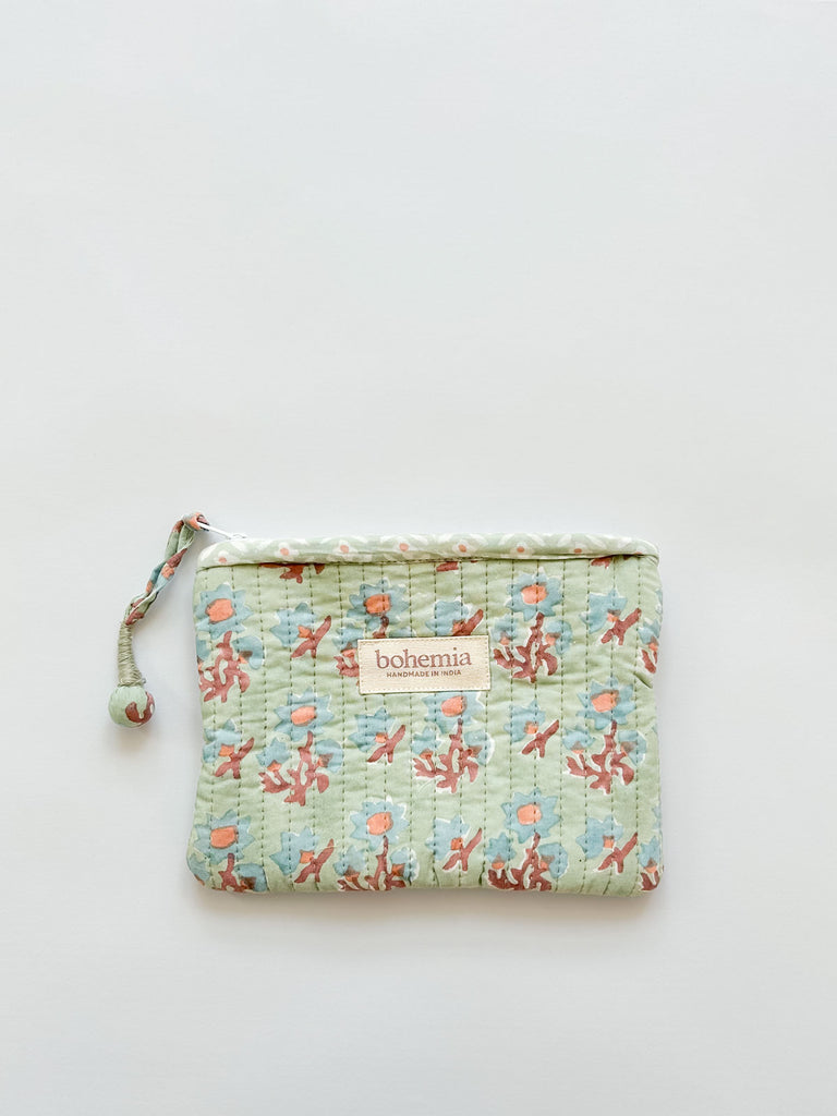 A medium size quilted zip pouch in soft green-blue and terracotta with a handcrafted zip pull | Bohemia