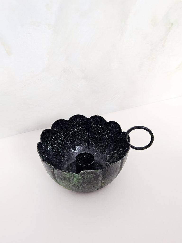 Top view of a scallop candle holder with a vintage finger hold in a rustic green-moss finish | Bohemia