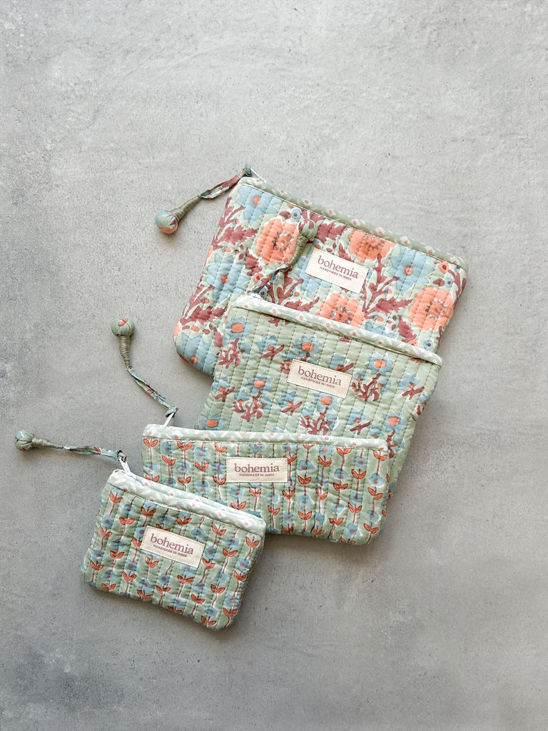 Four hand block printed zip pouches in delicate duck egg with blue and terracotta flowers by Bohemia Design