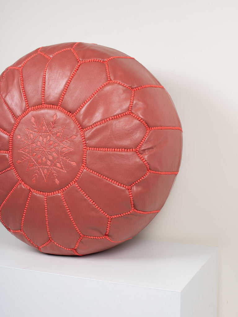 Moroccan leather pouffe in a terracotta colour with hand-stitched detail by Bohemia Design