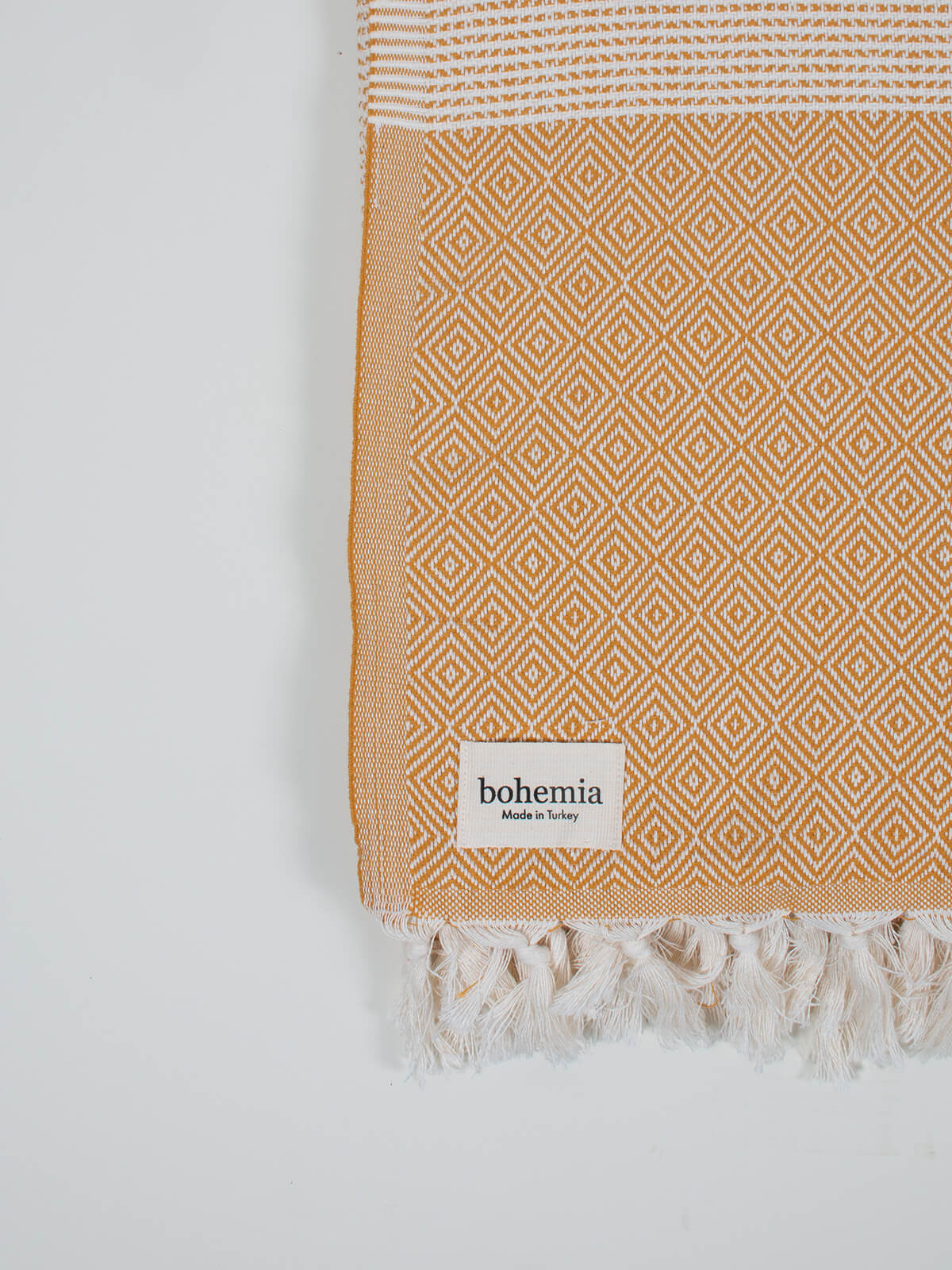 Nordic Dot Hammam Towel in mustard diamond pattern by Bohemia Design